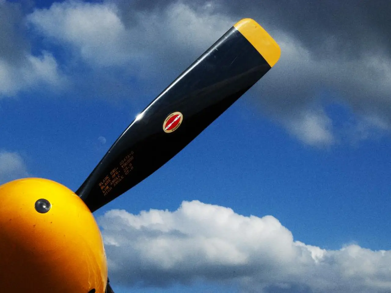 In this picture we can see fan of an airplane, and we can find clouds.