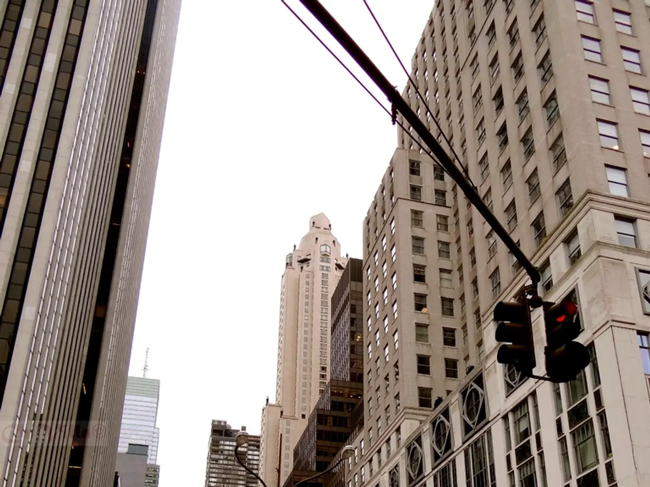 As we can see in the image there are buildings, traffic signals, windows, few people here and...