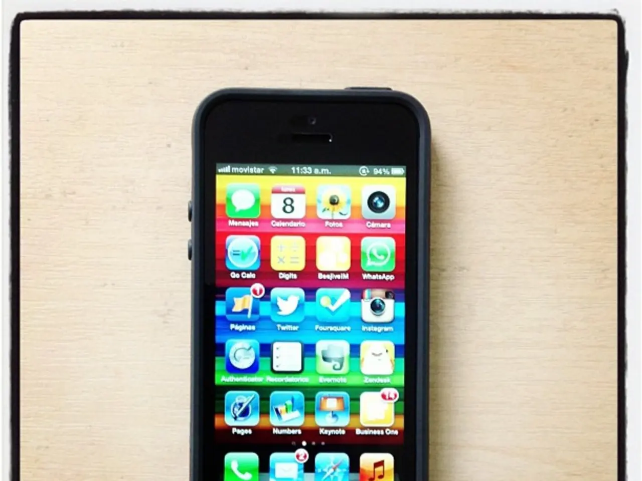 There is a mobile phone kept on the floor as we can see in the middle of this image.