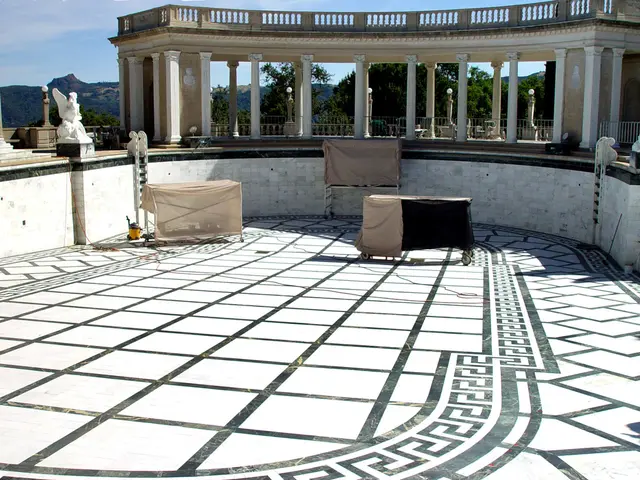 In this image there is a terrace, on that terrace there are three iron tables and there is a...