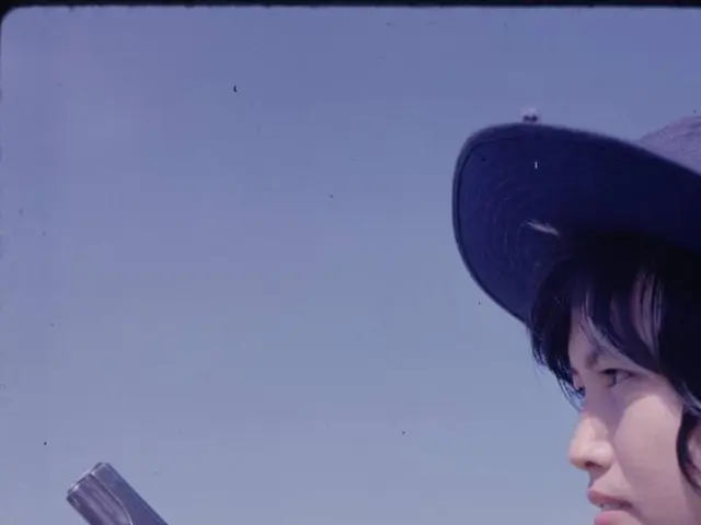 In this image in front there is a person holding the gun. In the background of the image there are...