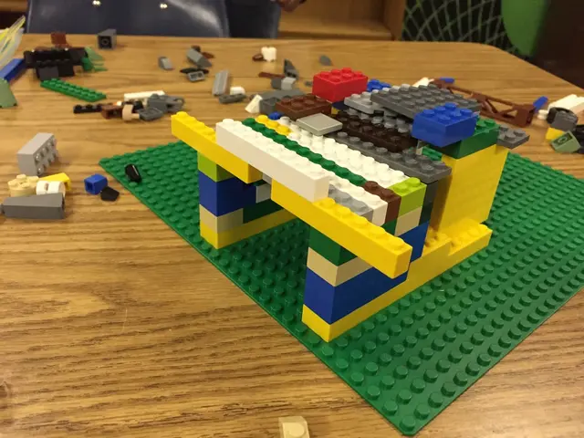 In this image we can see some toys placed on the wooden surface.