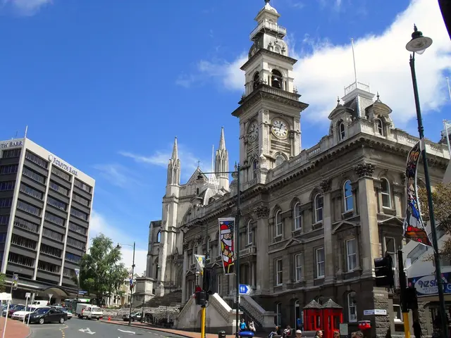 In the picture we can see a historical building and on it we can see a clock tower with clock on it...