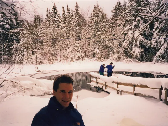 In the foreground of this image, there is a man. In the background, there are two people at the...