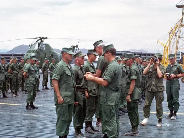 In this In this picture we can see there are groups of people standing. There are two persons...