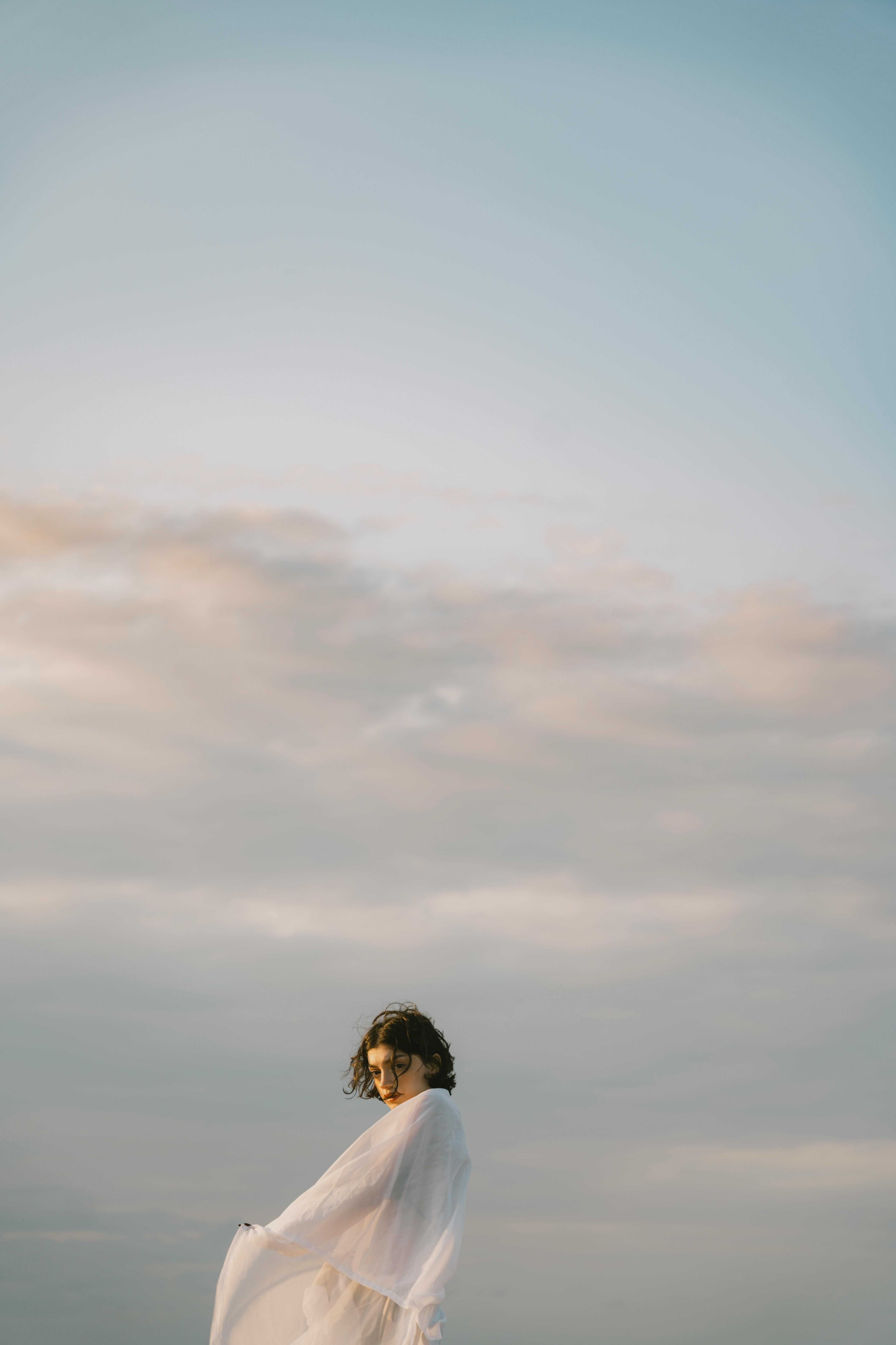 Man holding a handgun, aiming at a target with a determined expression on his face, outdoors at a shooting range. Cryptocurrency governance shifts as Aya Miyaguchi heads Ethereum Foundation, while Vitalik Buterin opposes UK's encryption key access plan.
